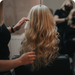 blonde-female-getting-new-hairstyle-hair-salon 2